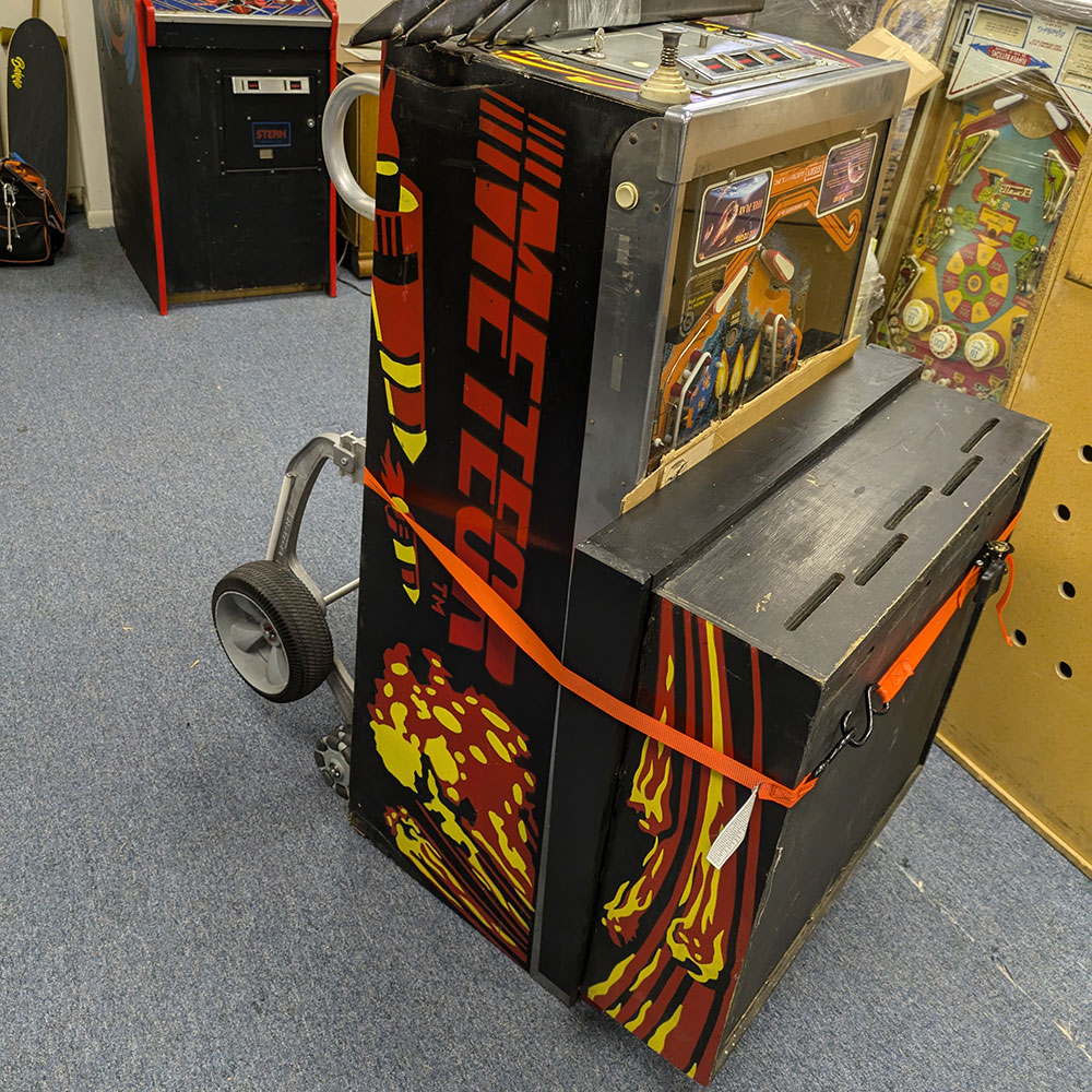 A folded up Stern Meteor pinball machine